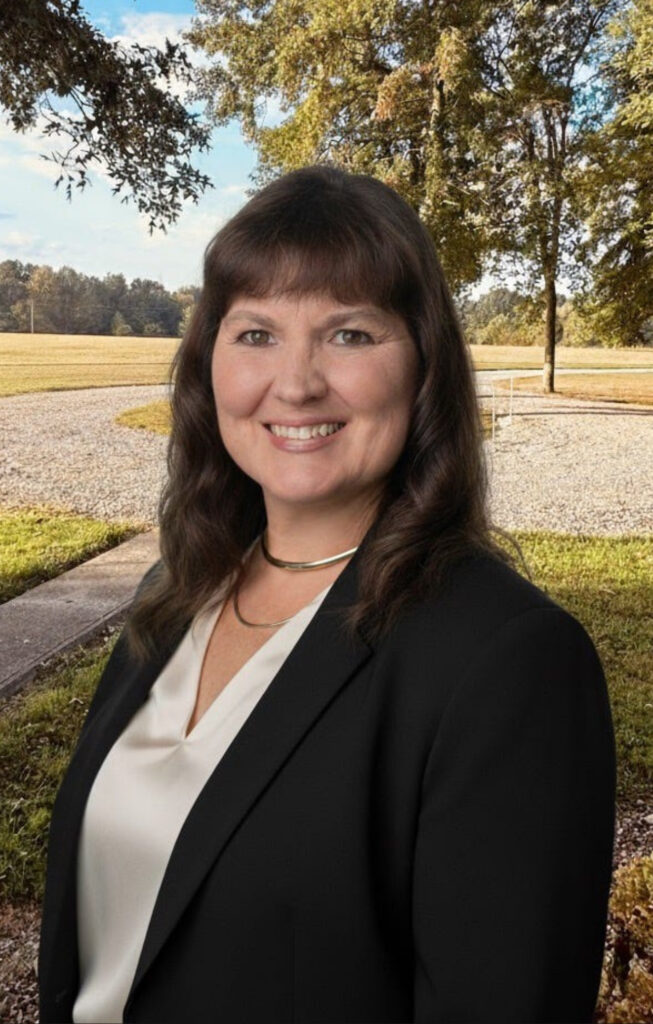 Angela Brooks smiling outdoors, representing authentic storytelling and women in digital business.