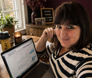 Woman reviewing content analytics on laptop showing UTM tracking data